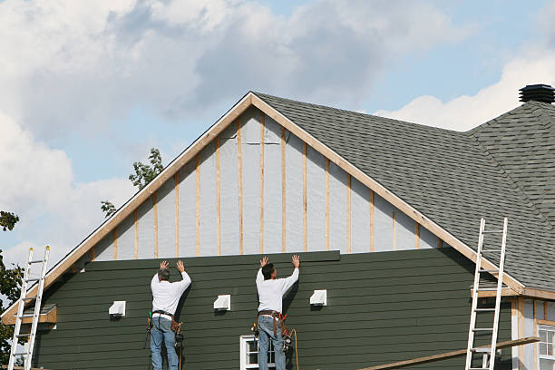 Professional Storm Damage Siding Repair technician working in Graham, TX